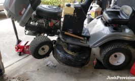 Grayson, our riding lawn mower, jacked up